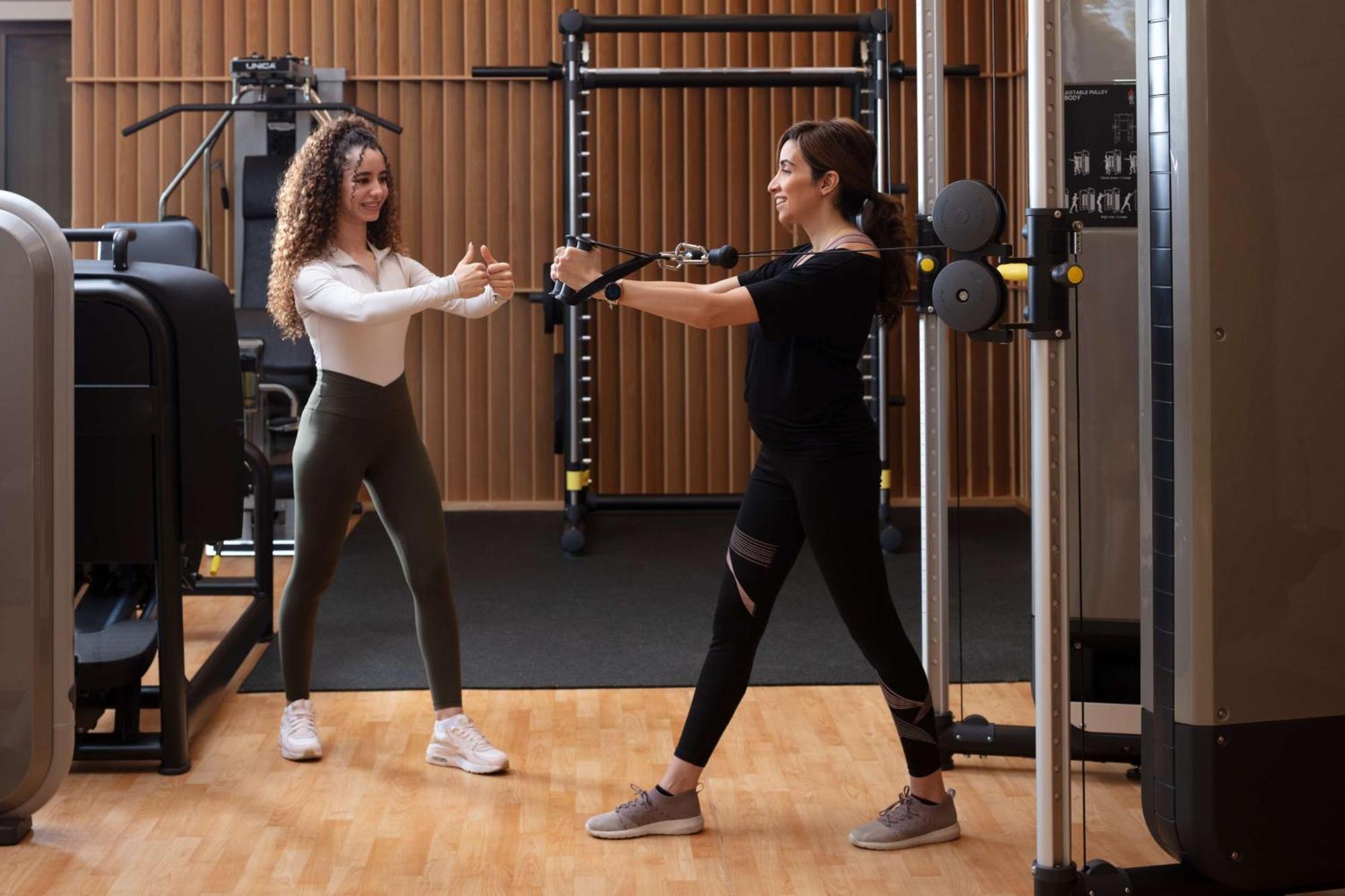 Hyatt Regency Riyadh Olaya Экстерьер фото Personal trainer working with a female client